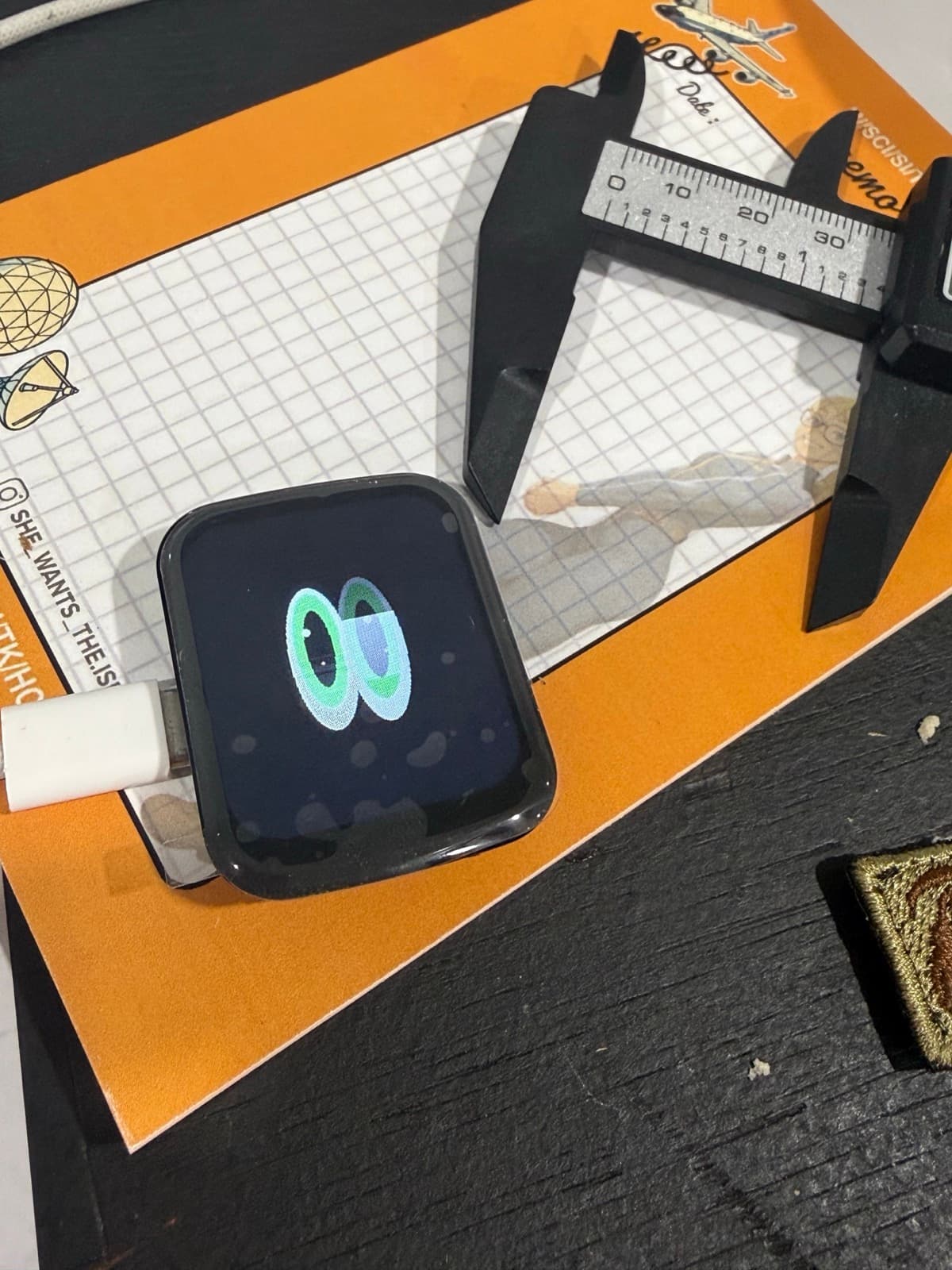 Harold prototype display showing a procedural face beside digital calipers